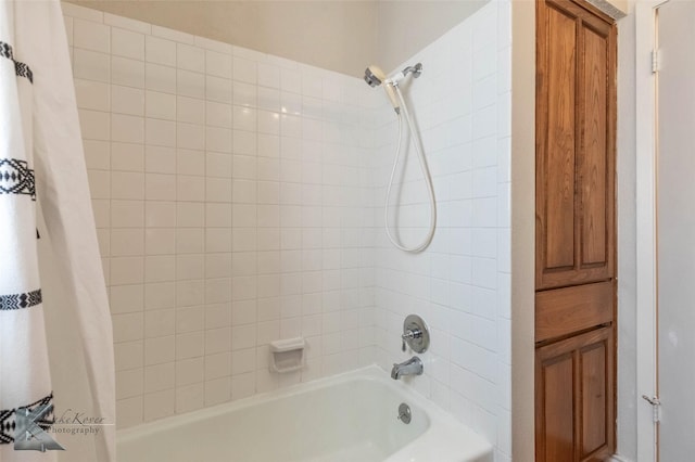 full bathroom featuring shower / bath combo with shower curtain