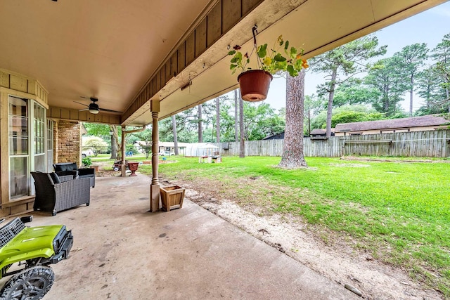 view of patio / terrace featuring a fenced backyard, an outdoor hangout area, and a ceiling fan