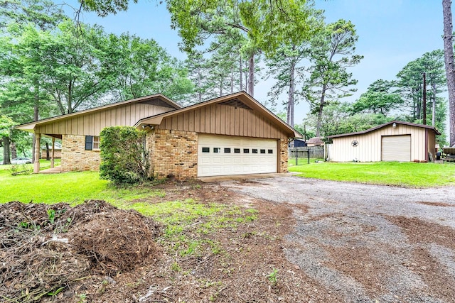 ranch-style home featuring a front yard, brick siding, driveway, and fence