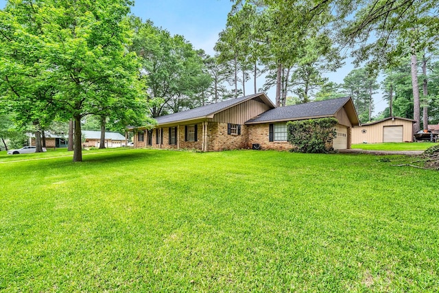 view of front of property featuring a garage, brick siding, and a front yard