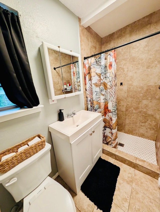 873 Beverly Dr, Terrell, TX 75160 - full bath featuring toilet, tiled shower, vanity, and tile patterned flooring