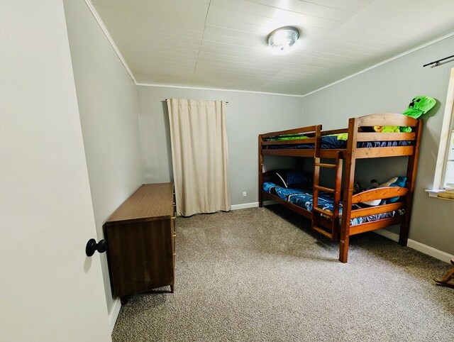 873 Beverly Dr, Terrell, TX 75160 - bedroom with carpet floors, baseboards, and crown molding