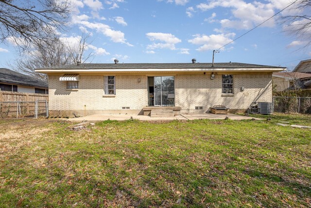 873 Beverly Dr, Terrell, TX 75160 - rear view of property featuring brick siding, a patio area, and central AC unit