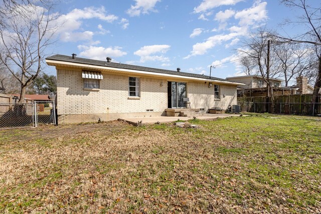 873 Beverly Dr, Terrell, TX 75160 - rear view of house with brick siding, a patio area, and central AC unit