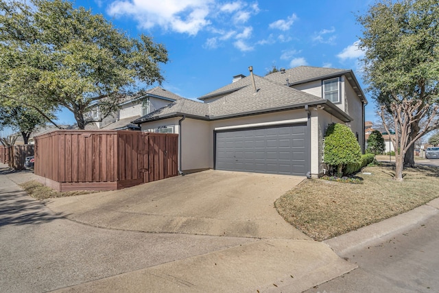 view of property exterior featuring driveway, a garage, roof with shingles, fence, and stucco siding