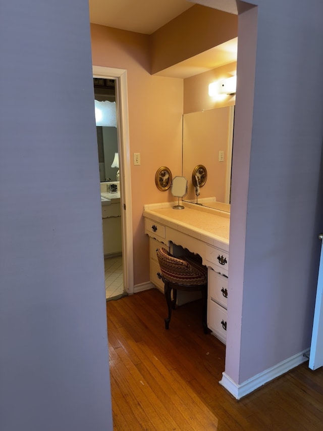 bathroom featuring baseboards and wood finished floors