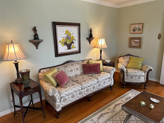 living room featuring baseboards and wood finished floors