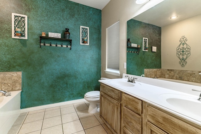 full bath featuring double vanity, a garden tub, a sink, and tile patterned floors