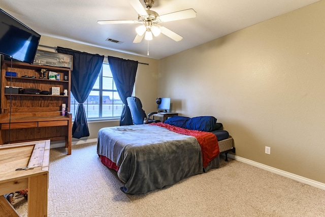 bedroom with ceiling fan, carpet, visible vents, and baseboards