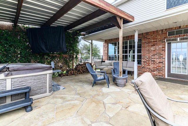 view of patio featuring an outdoor living space and a hot tub