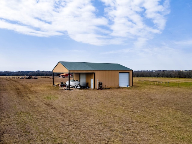 view of pole building featuring a rural view