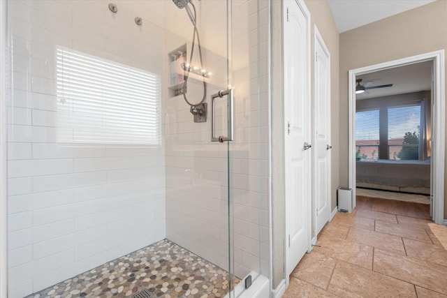 full bathroom featuring ensuite bathroom, a stall shower, and stone tile flooring