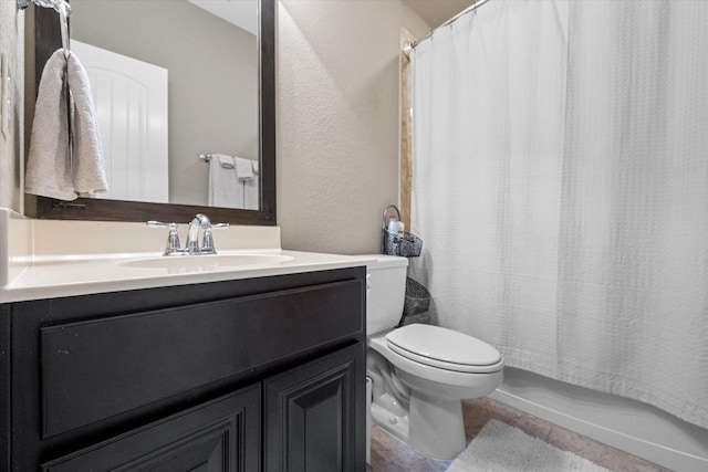 full bath featuring vanity, toilet, and tile patterned floors