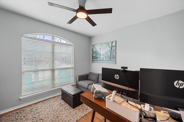 office with ceiling fan, baseboards, and wood finished floors