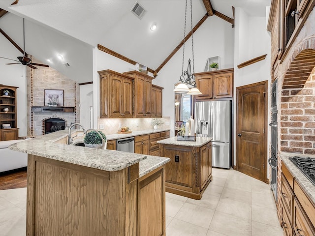 1300 Ruby Lea Ln, Fort Worth, TX 76179 - kitchen with stainless steel appliances, a center island, high vaulted ceiling, open floor plan, and ceiling fan
