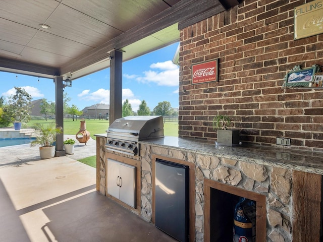 1300 Ruby Lea Ln, Fort Worth, TX 76179 - view of patio featuring an outdoor kitchen, an outdoor pool, and beverage cooler