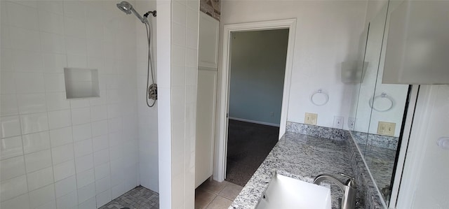 full bath featuring tile patterned floors, a shower stall, and vanity