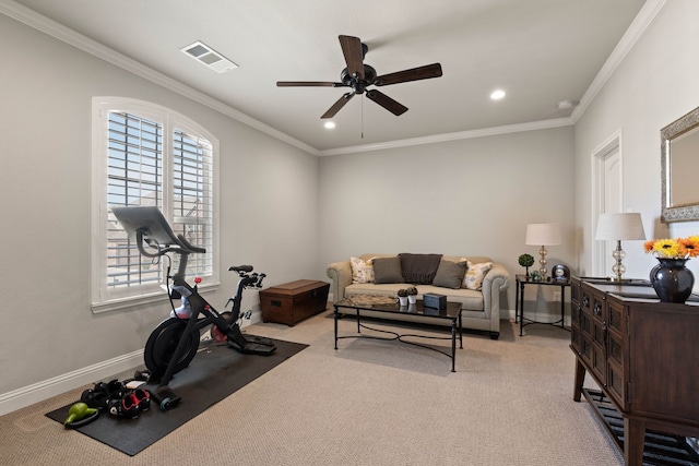 workout area with light colored carpet, visible vents, crown molding, and baseboards