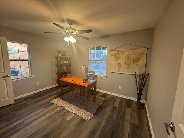 office with a ceiling fan, plenty of natural light, baseboards, and dark wood-style flooring