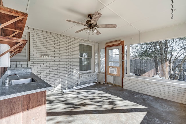 interior space featuring cooling unit, a sink, and ceiling fan