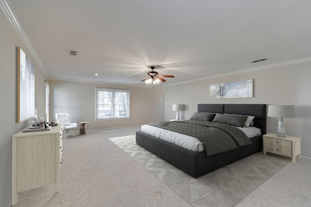 bedroom with ornamental molding, visible vents, and light colored carpet