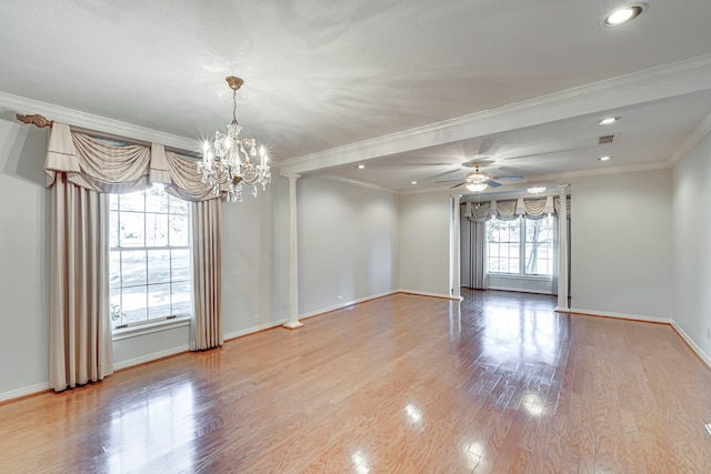 unfurnished room with light wood finished floors, baseboards, visible vents, ornamental molding, and ceiling fan with notable chandelier