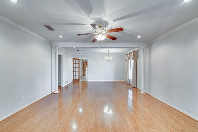 empty room with light wood-type flooring, visible vents, and crown molding