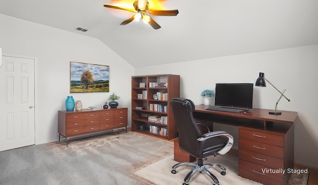 home office with lofted ceiling and ceiling fan
