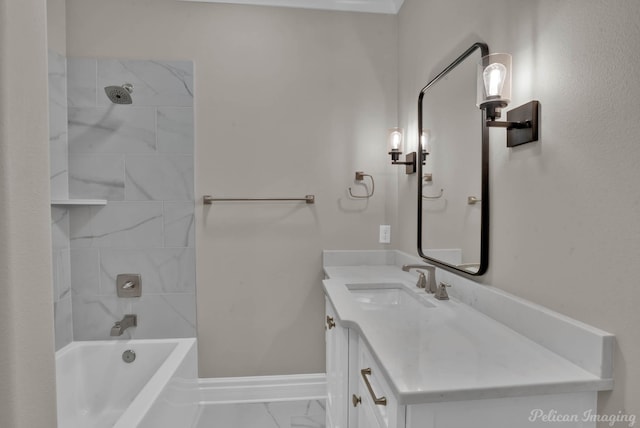 bathroom featuring marble finish floor, bathing tub / shower combination, baseboards, and vanity