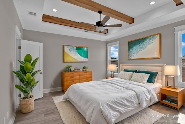 bedroom featuring recessed lighting, wood finished floors, visible vents, baseboards, and beamed ceiling