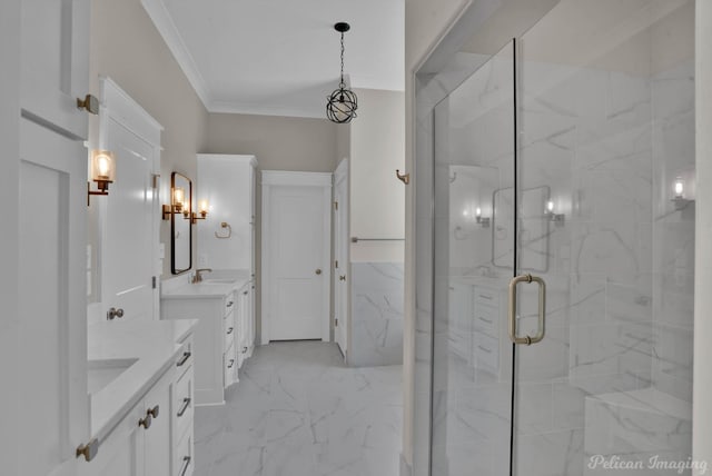 full bath featuring a sink, two vanities, marble finish floor, a marble finish shower, and crown molding