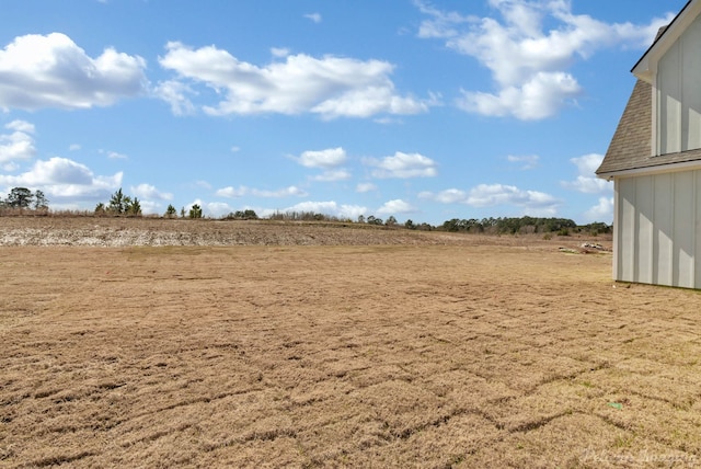 view of yard with a rural view