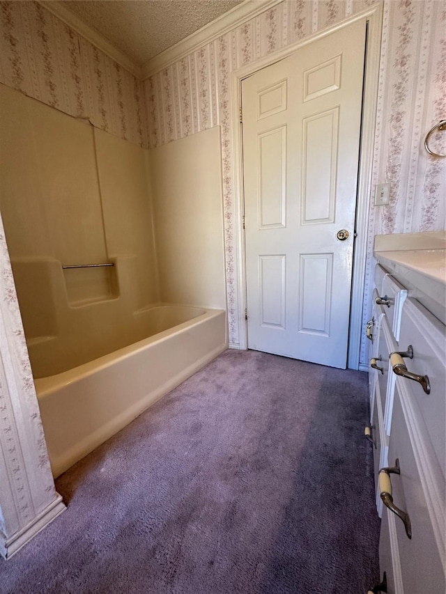 full bath with a textured ceiling, crown molding, carpet flooring, and wallpapered walls