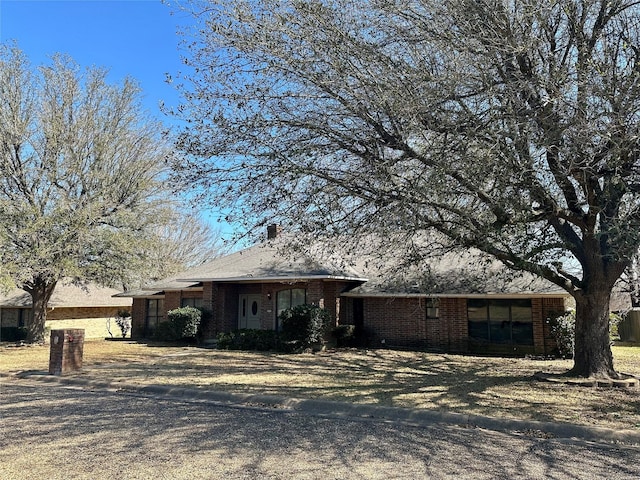 single story home with brick siding