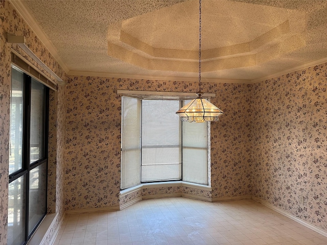 spare room featuring a healthy amount of sunlight, wallpapered walls, a textured ceiling, and crown molding