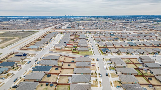 birds eye view of property with a residential view