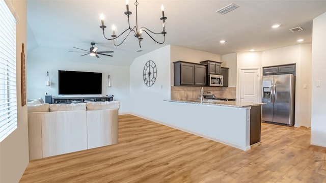 kitchen with stainless steel appliances, visible vents, and light wood-style floors