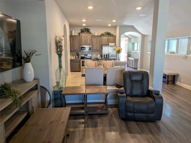 4248 Old Timber Ln, Fort Worth, TX 76036 - living room with arched walkways, recessed lighting, wood finished floors, and baseboards