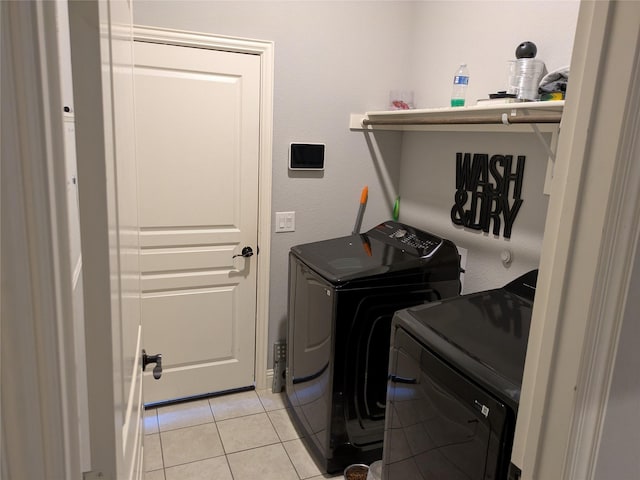 4248 Old Timber Ln, Fort Worth, TX 76036 - laundry area featuring light tile patterned floors, laundry area, and washing machine and dryer