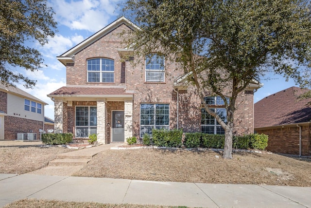 traditional-style home featuring brick siding