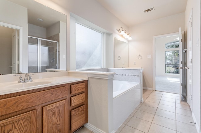 bathroom with a stall shower, visible vents, tile patterned flooring, vanity, and a bath