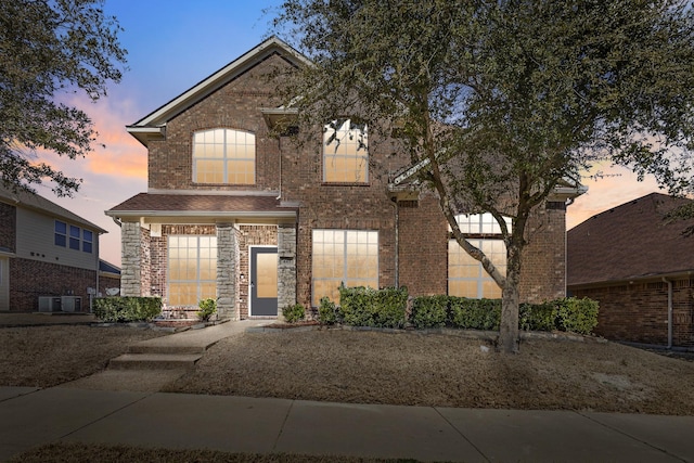 view of front of house featuring brick siding