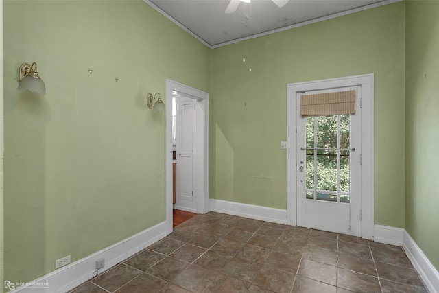 doorway to outside featuring crown molding, a ceiling fan, and baseboards