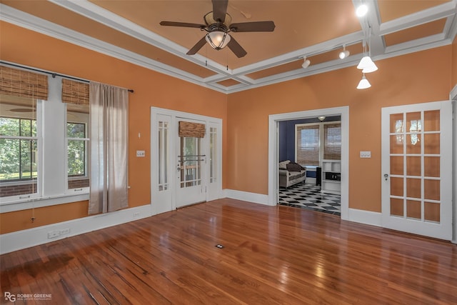 spare room featuring coffered ceiling, wood finished floors, a ceiling fan, baseboards, and track lighting