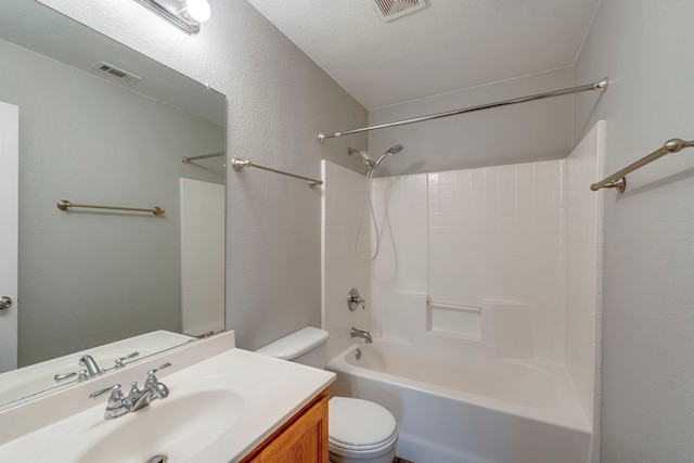 bathroom with washtub / shower combination, visible vents, vanity, and toilet