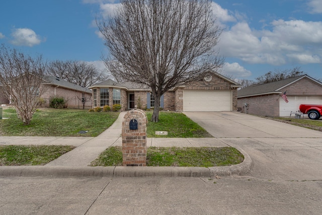 view of front of home featuring a garage, a front yard, concrete driveway, and brick siding