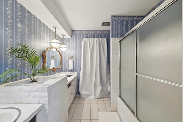 full bath featuring tile patterned flooring, enclosed tub / shower combo, vanity, and wallpapered walls