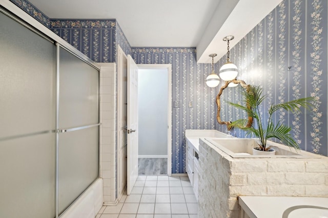 bathroom with tile patterned floors, vanity, and wallpapered walls