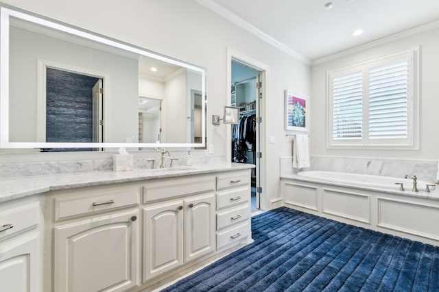 full bath with a bath, a spacious closet, crown molding, and vanity