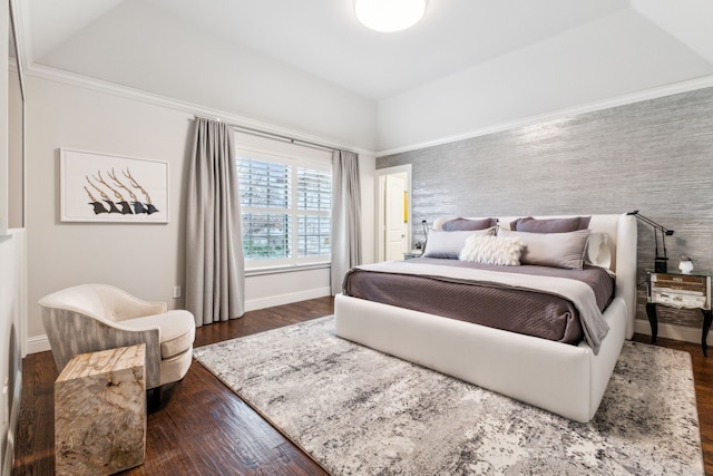 bedroom featuring dark wood-type flooring, vaulted ceiling, and baseboards